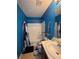 Blue bathroom with a tub and shower combination featuring a Black Panther shower curtain at 212 Meadowlark Place, Austell, GA 30168