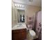 Cozy bathroom with neutral walls, decorative shower curtain and coordinated towel accents at 212 Meadowlark Place, Austell, GA 30168