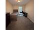 Neutral bedroom featuring a twin bed, carpet, and desk at 212 Meadowlark Place, Austell, GA 30168