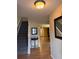 Welcoming foyer featuring hardwood floors, staircase, and decor, creating an inviting ambiance at 212 Meadowlark Place, Austell, GA 30168