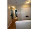 Hallway with wood flooring and doors to a bathroom at 212 Meadowlark Place, Austell, GA 30168
