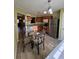 Charming eat-in kitchen area featuring stainless steel appliances, and warm wood cabinetry at 212 Meadowlark Place, Austell, GA 30168