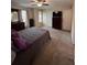 A cozy bedroom with a ceiling fan, carpet, natural light from windows, and a dresser at 212 Meadowlark Place, Austell, GA 30168