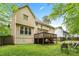 Expansive backyard featuring a wooden deck and ample green space, perfect for outdoor activities and relaxation at 10044 Point View Dr, Jonesboro, GA 30238