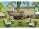 Large backyard with a deck, patio and firepit seating area at 10044 Point View Dr, Jonesboro, GA 30238