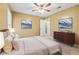 Bright and airy bedroom featuring hardwood floors, neutral walls and lots of natural light at 10044 Point View Dr, Jonesboro, GA 30238