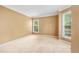 Spacious bedroom with ample natural light, neutral carpet, and large windows at 10044 Point View Dr, Jonesboro, GA 30238
