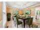 Formal dining room with elegant wainscoting, chandelier, and seating for six guests at 10044 Point View Dr, Jonesboro, GA 30238
