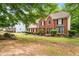 Charming two-story brick home with classic design and manicured landscaping at 10044 Point View Dr, Jonesboro, GA 30238