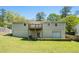 View of the back of the home featuring a deck, walk out basement and a large yard at 1085 Azalea Ne Cir, Marietta, GA 30062