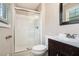 Bathroom features a white shower with sliding glass door, a white toilet and sink at 1085 Azalea Ne Cir, Marietta, GA 30062