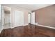 Bedroom featuring wood floors and multiple entry ways to closets and bathroom at 1085 Azalea Ne Cir, Marietta, GA 30062