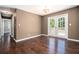 Dining room with hardwood floors, neutral walls, and stylish French doors to the outside deck at 1085 Azalea Ne Cir, Marietta, GA 30062