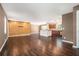Open concept living area with hardwood floors, island with seating, and view of the kitchen at 1085 Azalea Ne Cir, Marietta, GA 30062