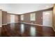 Spacious living room featuring rich hardwood floors, neutral paint, and ample natural light at 1085 Azalea Ne Cir, Marietta, GA 30062