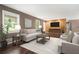 Stylishly furnished living room featuring hardwood floors, comfortable seating, and a mounted TV at 1085 Azalea Ne Cir, Marietta, GA 30062