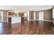 Hardwood floor, and island seating with views of the kitchen's granite counters and stainless steel appliances at 1085 Azalea Ne Cir, Marietta, GA 30062