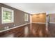 Bright living room with hardwood floors, large windows, and modern wall textures at 1085 Azalea Ne Cir, Marietta, GA 30062