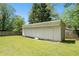 View of the shed in the back yard of the home featuring a gabled roof at 1085 Azalea Ne Cir, Marietta, GA 30062