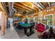 Partially finished basement, featuring a pool table and exposed ceiling beams at 1144 Bellewood Sq, Dunwoody, GA 30338