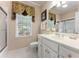 Bright bathroom with a white vanity, a large mirror, and a shower/tub combo at 1144 Bellewood Sq, Dunwoody, GA 30338