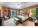 Spacious bedroom offering ample natural light through large windows and comfortable furnishings at 1144 Bellewood Sq, Dunwoody, GA 30338