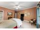 Comfortable bedroom featuring a large bed and framed photos on the wall at 1144 Bellewood Sq, Dunwoody, GA 30338