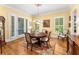Classic dining room featuring hardwood floors, a chandelier, and French doors at 1144 Bellewood Sq, Dunwoody, GA 30338