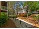 Exterior view of a well-maintained home with manicured landscaping and stone pathway at 1144 Bellewood Sq, Dunwoody, GA 30338