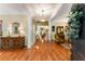 Grand foyer featuring hardwood floors, white columns, and elegant decorative details at 1144 Bellewood Sq, Dunwoody, GA 30338
