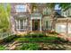 Beautiful brick home featuring a two-car garage and lovely manicured lawn with stone walkway at 1144 Bellewood Sq, Dunwoody, GA 30338