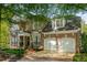 Beautiful two-story brick home featuring a two-car garage and manicured lawn at 1144 Bellewood Sq, Dunwoody, GA 30338