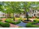 Charming neighborhood street featuring an elegant water fountain and meticulously manicured lawns at 1144 Bellewood Sq, Dunwoody, GA 30338