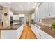 Bright kitchen boasts granite counters, stainless appliances, and white cabinetry at 1144 Bellewood Sq, Dunwoody, GA 30338