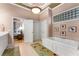 Another angle showing the beautiful bathroom with a large soaking tub, perfect for relaxation at 1144 Bellewood Sq, Dunwoody, GA 30338