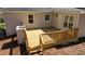 Wooden back deck with stairs and railing, perfect for outdoor relaxation and entertaining at 2215 Gordon Se Cir, Smyrna, GA 30080