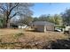 The backyard view shows a wooden deck, carport, and ample outdoor space at 2215 Gordon Se Cir, Smyrna, GA 30080