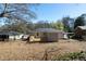 This backyard view features a wooden deck, carport, and spacious outdoor area at 2215 Gordon Se Cir, Smyrna, GA 30080