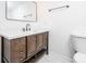 Bathroom vanity with dark wood cabinets, white countertop, and sleek fixtures at 2215 Gordon Se Cir, Smyrna, GA 30080