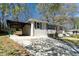 The home's exterior has a covered carport and well-maintained front yard at 2215 Gordon Se Cir, Smyrna, GA 30080