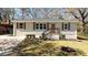 Well-maintained home with neutral siding, complemented by a manicured lawn and attractive landscaping at 2215 Gordon Se Cir, Smyrna, GA 30080