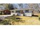 Cozy single-story home with a traditional design, surrounded by a well-kept lawn and mature trees at 2215 Gordon Se Cir, Smyrna, GA 30080