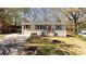 Charming single-story home featuring a well-maintained lawn and inviting front porch with classic curb appeal at 2215 Gordon Se Cir, Smyrna, GA 30080