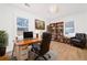 Stylish home office with a bookshelf, desk, comfortable chair, and natural lighting at 2215 Gordon Se Cir, Smyrna, GA 30080