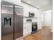 Modern kitchen with stainless steel appliances and white cabinets, complete with sleek fixtures and finishes at 2215 Gordon Se Cir, Smyrna, GA 30080