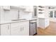 The kitchen features stainless steel appliances, modern white cabinets, a new backsplash, and an undermount sink at 2215 Gordon Se Cir, Smyrna, GA 30080