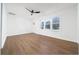 A living room featuring a modern ceiling fan, hardwood floors, and natural light at 2215 Gordon Se Cir, Smyrna, GA 30080