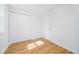 Bright room with wood-look flooring, white walls, and closet with double doors at 2215 Gordon Se Cir, Smyrna, GA 30080