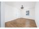 Bright and airy room with modern lighting, wood floors, and a large window at 2215 Gordon Se Cir, Smyrna, GA 30080