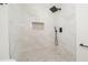 Modern shower with elegant white marble tile, black fixtures, and built-in niche at 2215 Gordon Se Cir, Smyrna, GA 30080